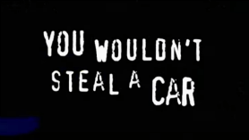 Still from a 00s anti-piracy advert. Text saying "you wouldn't steal a car".